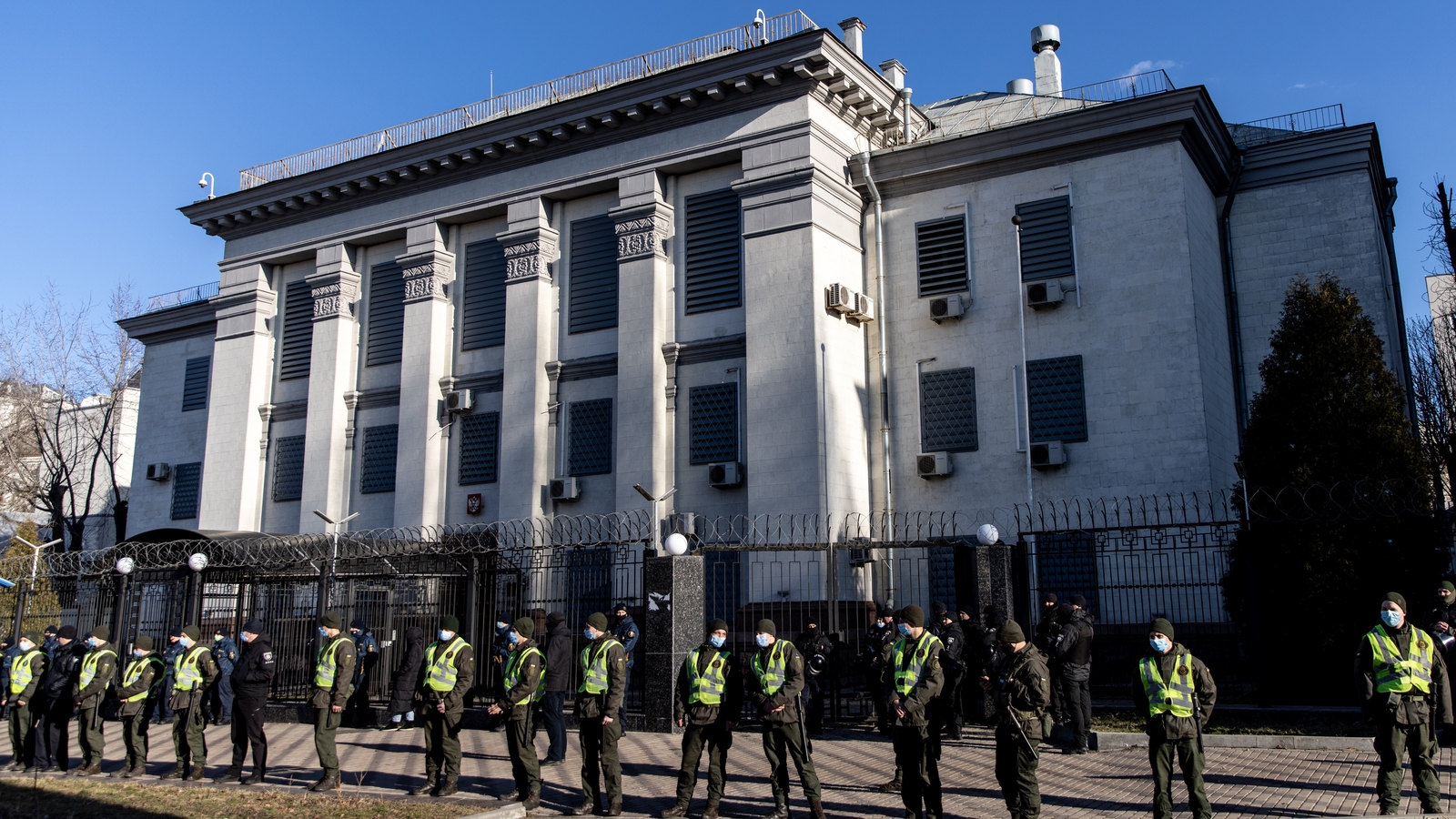 Police stand guard outside the Russian Embassy in Kyiv during a protest, before the invasion, on 22 February