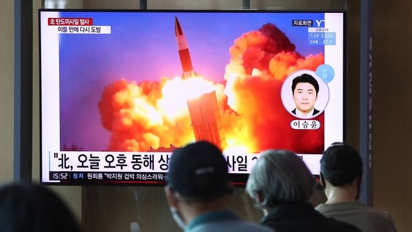 People watch TV in Seoul in September 2021 showing a file image of a North Korean missile launch in Seoul, South Korea