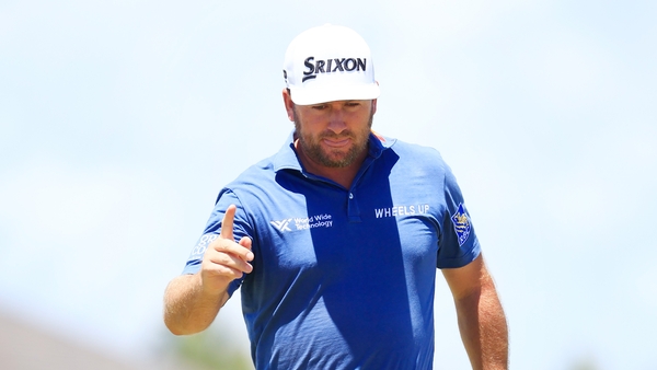 McDowell enjoys a birdie on 18