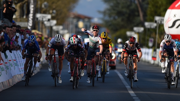 Eddie Dunbar celebrates his win while crossing the line