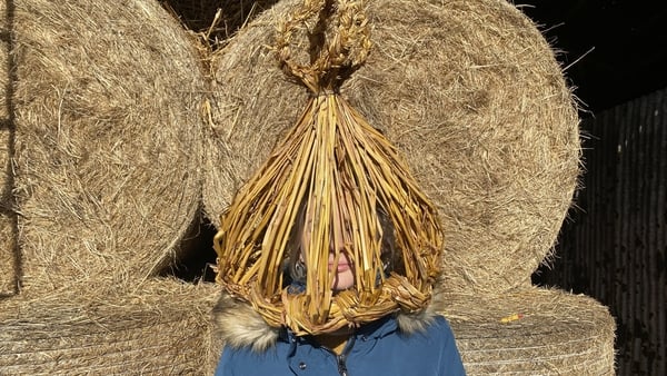 Edwina Guckian wearing a strawboy hat she made