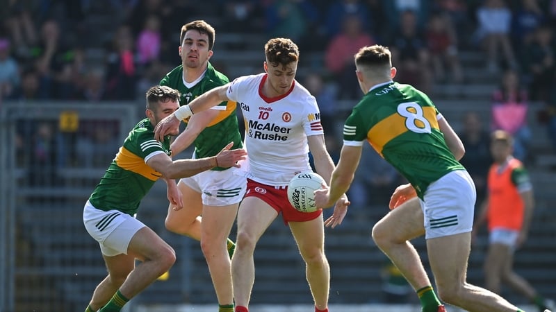 Conor Meyler of Tyrone in action against Kerry players Graham O'Sullivan, Brian Ó Beaglaíoch and Diarmuid O'Connor