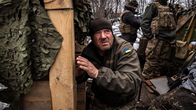 A Ukrainian serviceman waits in a trench at the frontline east of Kharkiv today