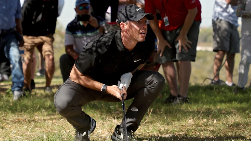 McIlroy follows his shot on the 18th hole