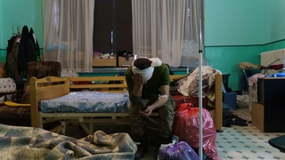 A wounded soldier waits for treatment at the military hospital in Zaporizhzhya, Ukraine