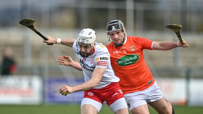 Tyrone's Damian Casey tries to get away from Tiarnan Nevin