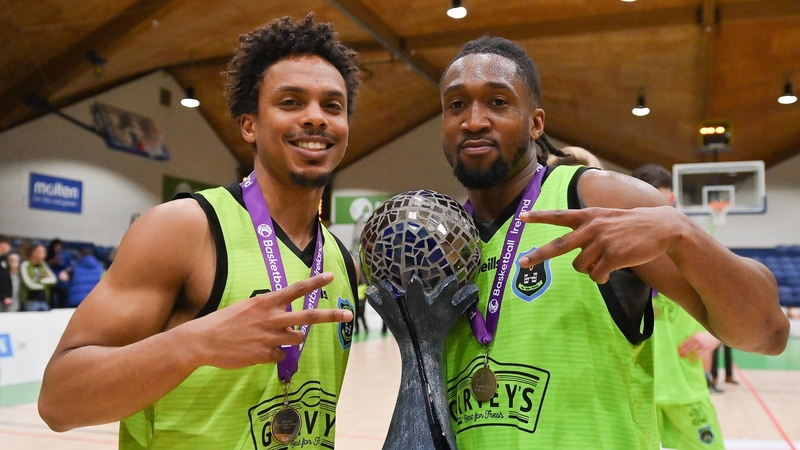 Garvey's Tralee Warriors players Brandon Cotton, left, and Aaron Calixte celebrate with the Superleague trophy