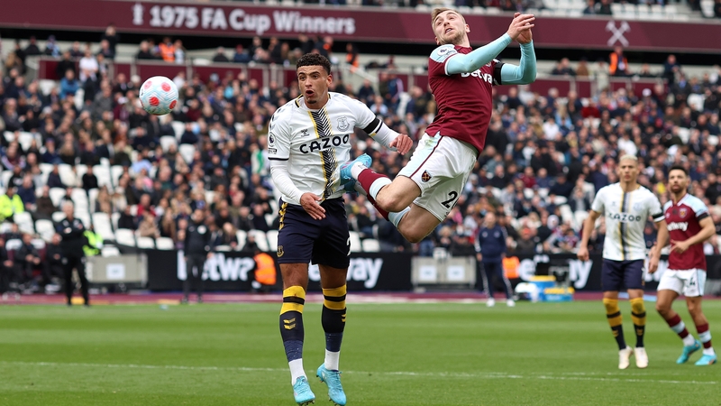 Ben Godfrey of Everton fails to out jump West Ham's Jarrod Bowen