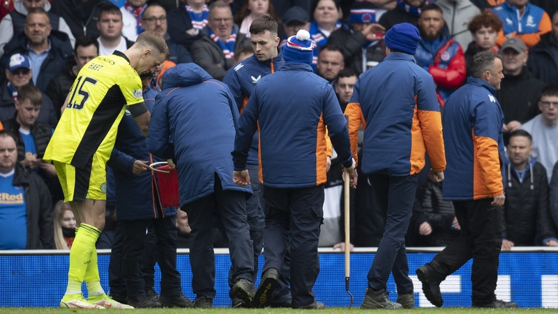 Groundstaff inspect the pitch for glass after a bottle is thrown at Joe Hart
