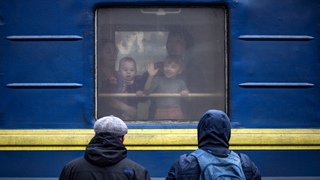 Children wave from a train at Kramatorsk central station in the Donbas region