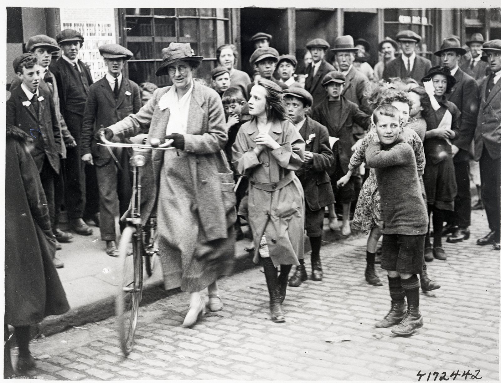 Countess Markievicz toured polling stations on her bicycle - and attracted some curious young observers. Photo: Bettmann/Getty Images