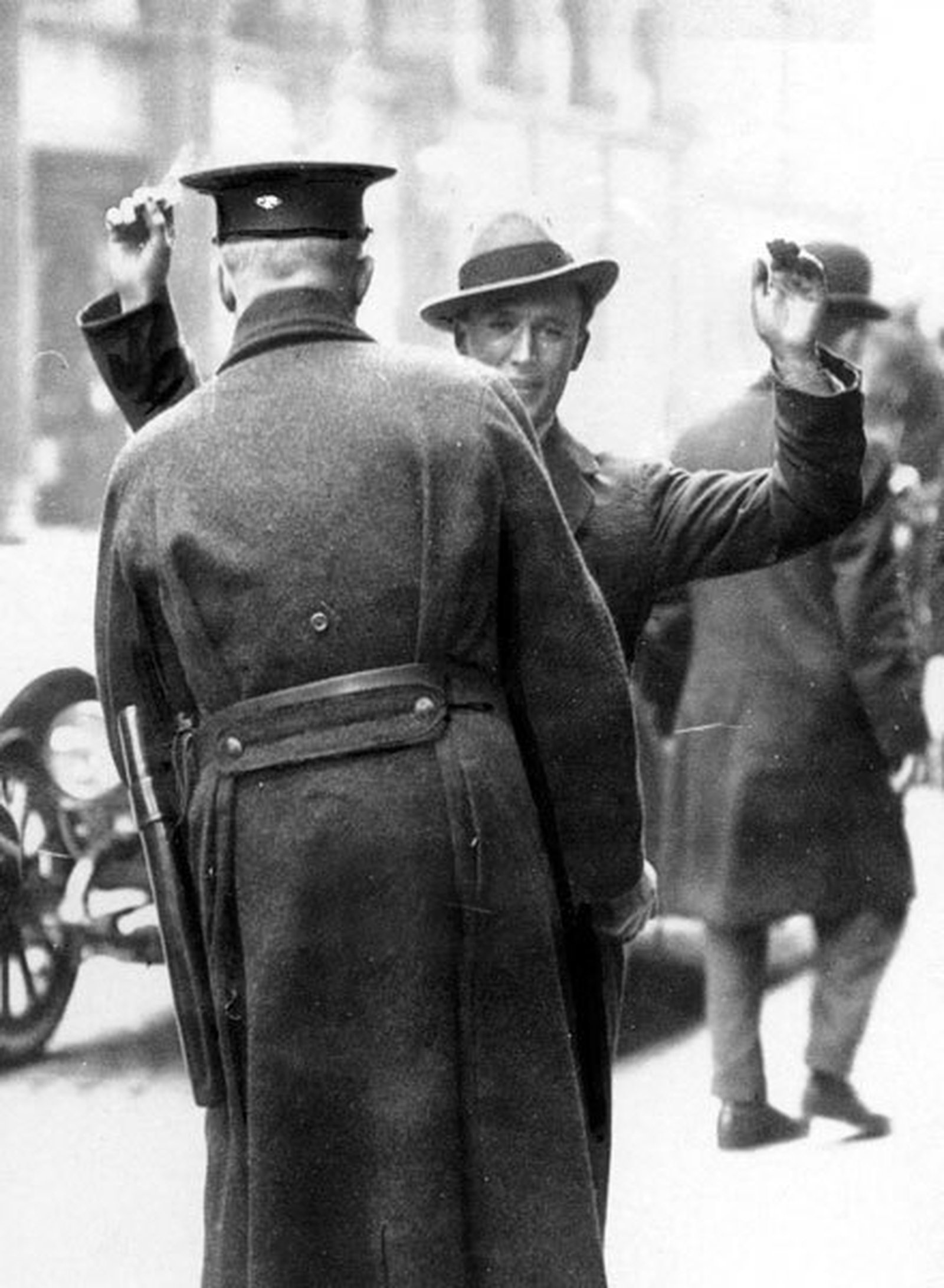 A civilian in Belfast is searched by a police officer, April 1922 (Courtesy of Belfast Telegraph)