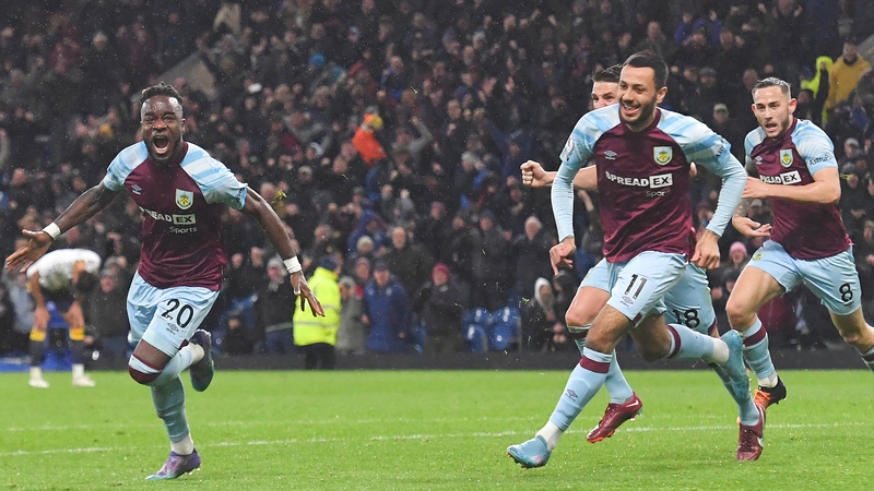 Burnley's Maxwel Cornet (L) wheels away in celebration