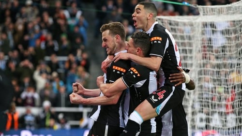 Chris Wood is mobbed after scoring his penalty