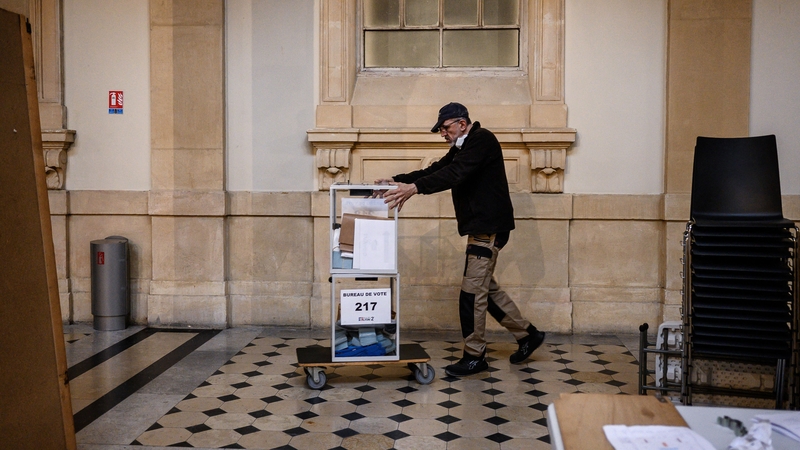 A City Hall employee preparing a polling station in Lyon, France, today ahead of the election there tomorrow
