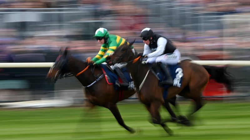 Mark Walsh (l) on Sire Du Berlais approach the finish line before Danny Mullins on Flooring Porter