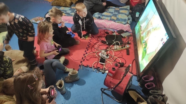 The children draw, read, play cards and watch TV when there is electricity