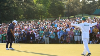 Scottie Scheffler and caddie Ted Scott celebrate winning the Masters