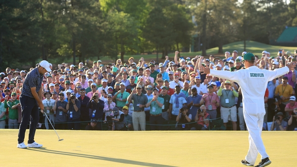 Scottie Scheffler and caddie Ted Scott celebrate winning the Masters
