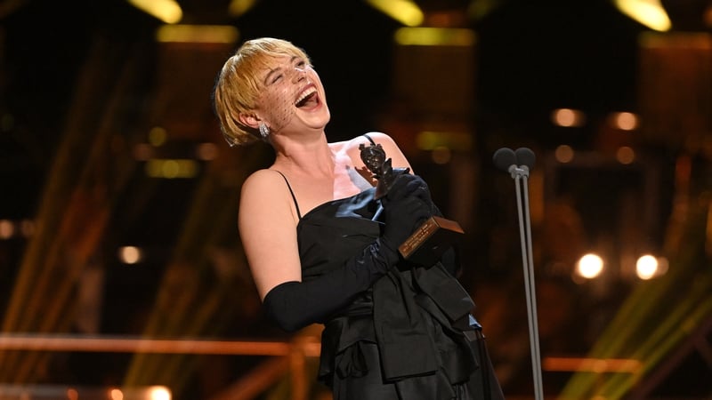 Jessie Buckley accepts the award for Best Actress in a Musical for "Cabaret" on stage during The Olivier Awards 2022