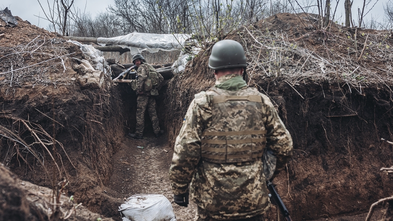 Ukrainian soldiers in a trench on the frontline in Donbas today