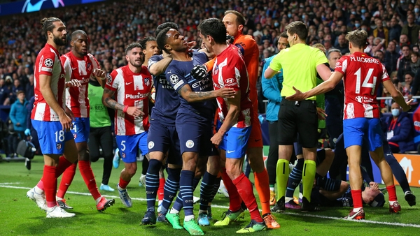 Raheem Sterling of Manchester City clashes with Stefan Savic of Atletico Madrid