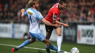 Will Patching of Derry City in action against Aaron O'Driscoll of Shelbourne