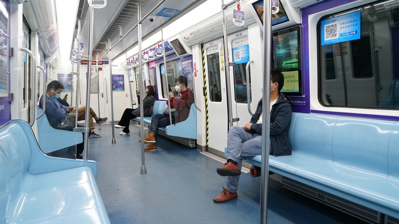 Passengers ride a subway train in Xian after the city imposed a four-day partial lockdown