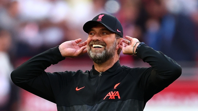 Jurgen Klopp celebrates with the Liverpool fans after the game