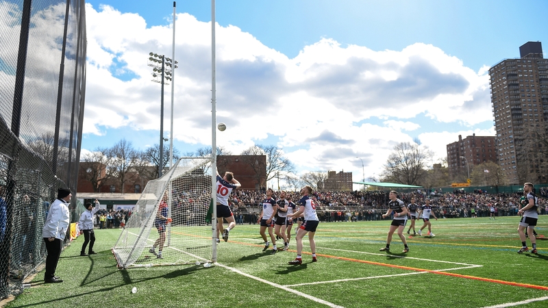 Players watch as a New York attempt comes back off the crossbar