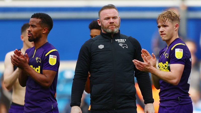 Wayne Rooney and his players salute the away support as their relegation was confirmed at Loftus Road