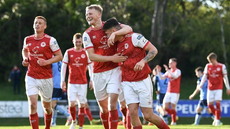 Joe Redmond, right, celebrates with team mate Tom Grivosti after hitting the winner