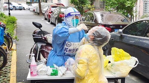 China has instituted a policy of hard lockdowns and mass testing to try to stop the spread of Covid-19