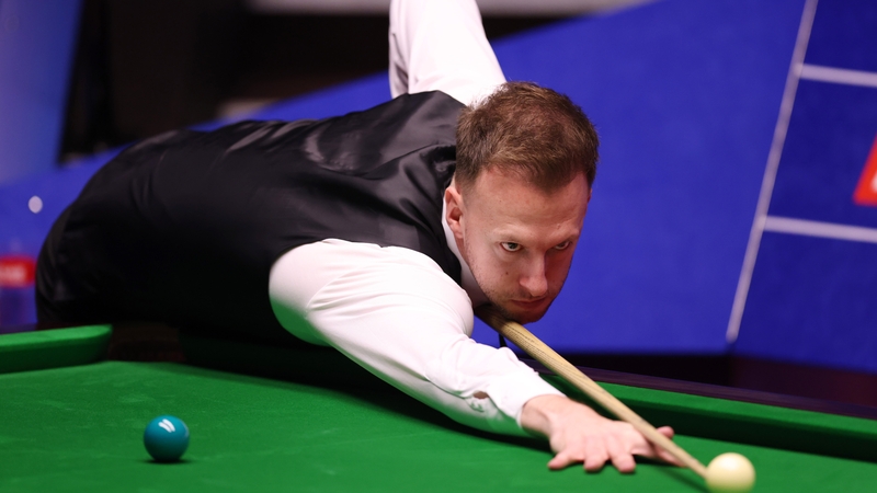 Judd Trump plays a shot against Iran's Hossein Vafaei