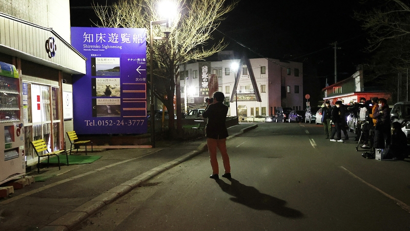 Reporters gather in front of the company building of Shiretoko Sightseeing
