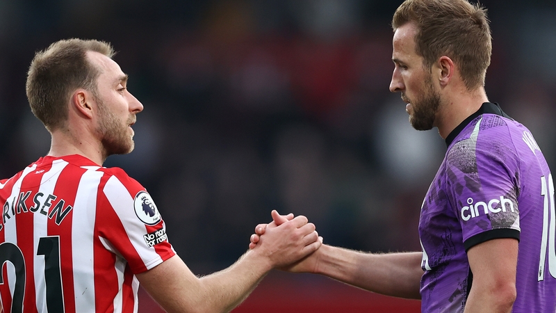 Christian Eriksen embraces former team-mate Harry Kane after the game