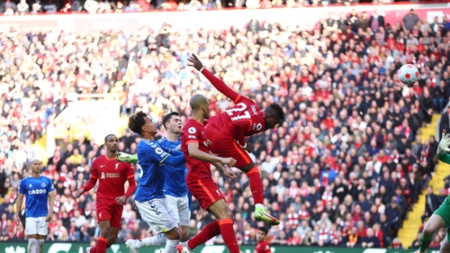 Divock Origi heads home Liverpool's second
