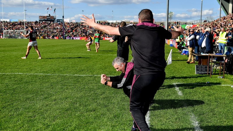Galway manager Padraic Joyce (C) and selector John Concannon celebrate at the final whistle