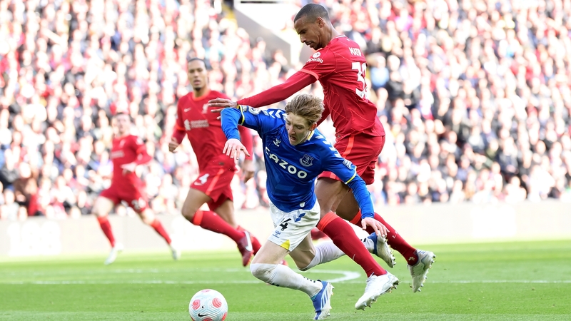 Everton's Anthony Gordon goes down under pressure by Joel Matip