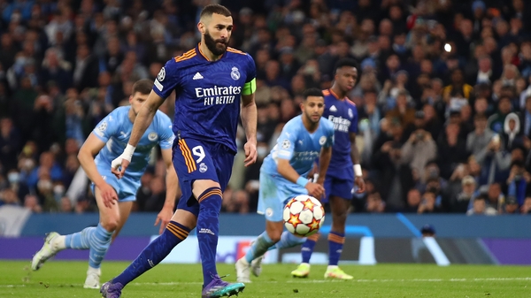Real Madrid striker Karim Benzema scores from the spot for the final goal of the game as Man City won 4-3 at the Etihad Stadium