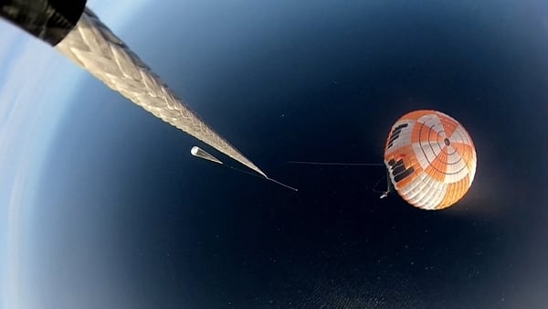 The rescue helicopter demonstrates how it will attempt to pluck the 39-foot-tall booster stage from mid-air using a combination of ropes, parachutes, heatshields and complex computer algorithms