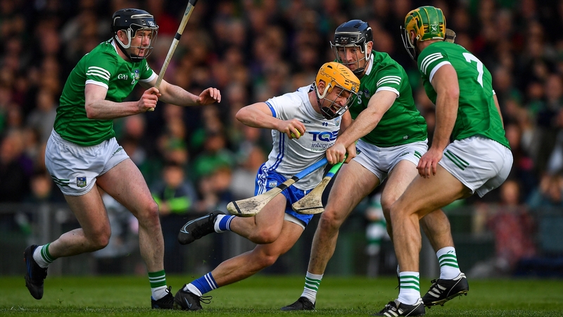 Waterford's Jack Prendergast is tackled by Limerick's Declan Hannon, Diarmaid Byrnes and Dan Morrisey