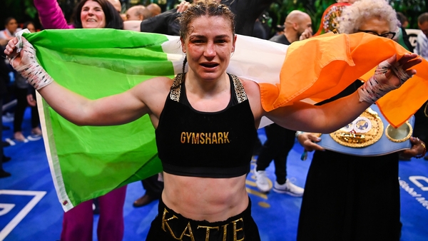 Katie Taylor celebrates inside the ring following the victory