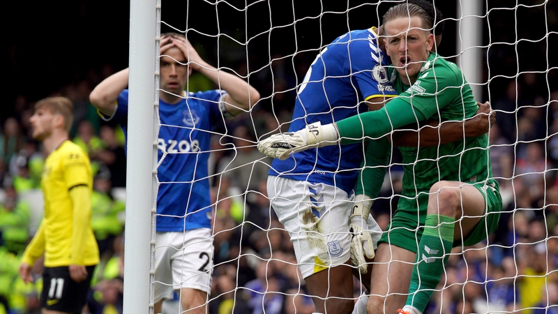 Seamus Coleman (L) reacts in disbelief to Pickford's match-winning save