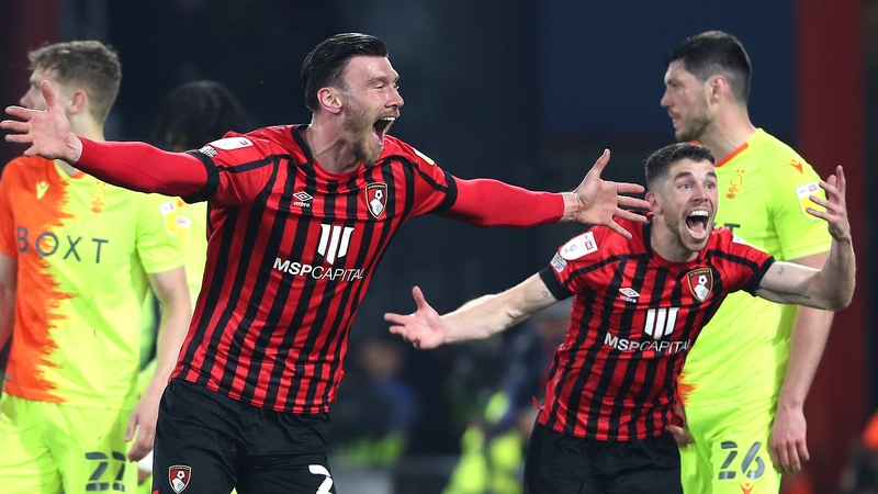 Kieffer Moore (L) celebrates scoring the opening goal for Bournemouth