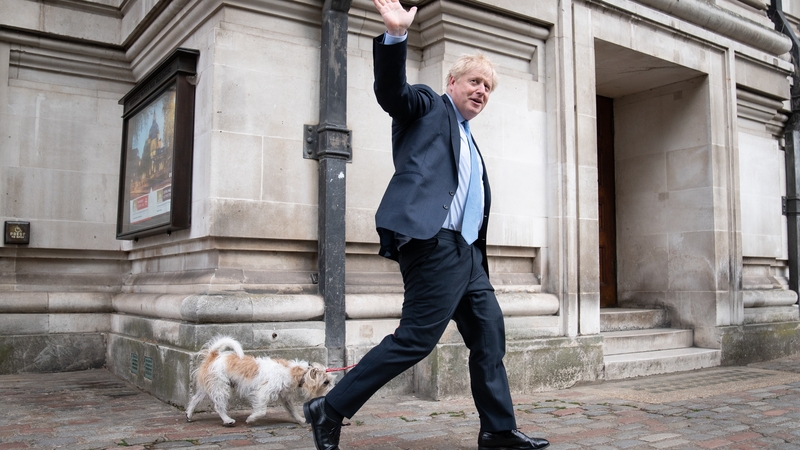 Prime Minister Boris Johnson leaves Methodist Central Hall in London with his dog Dilyn after voting in today's local government elections