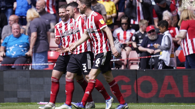 Enda Stevens (centre) celebrates with team-mates after scoring Sheffield United's fourth goal