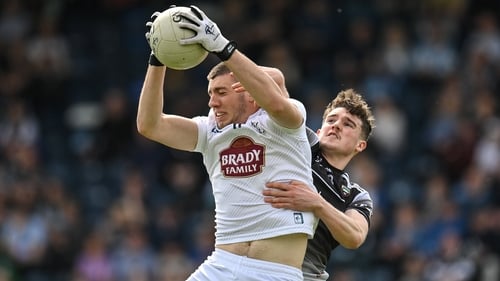 Daniel Lynam of Kildare claims a high ball ahead of Sligo's Canice Mulligan