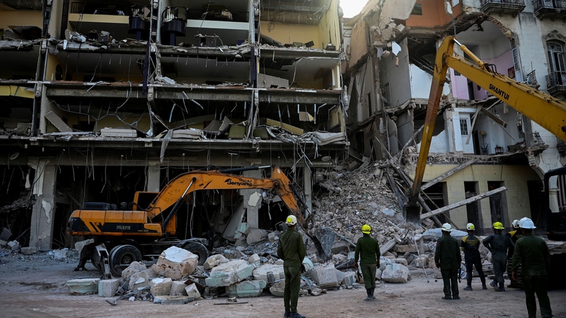 Rescuers remove debris from the ruins of the Saratoga Hotel in Havana