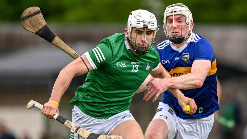 Limerick's double goalscorer Aaron Gillane is tackled by Seamus Kennedy of Tipperary